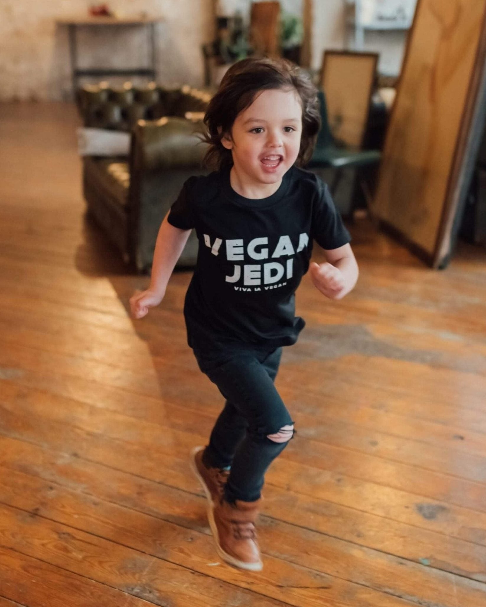 Model running wearing vegan jedi kids t-shirt