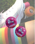 A picture of a pair of vinatge roller skates with an overlay of the product being sold which is a small (25mm) sized badge with a rooler skate and the words "Vegan Skater - Thats how I roll" on it. Designed by Viva La Vegan.