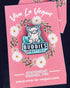 Pink pig pin on a turquoise background with the wording Buddies NOT Butties. By Eco ethical brand Viva La Vegan