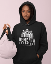 Person wearing a black hoodie with &