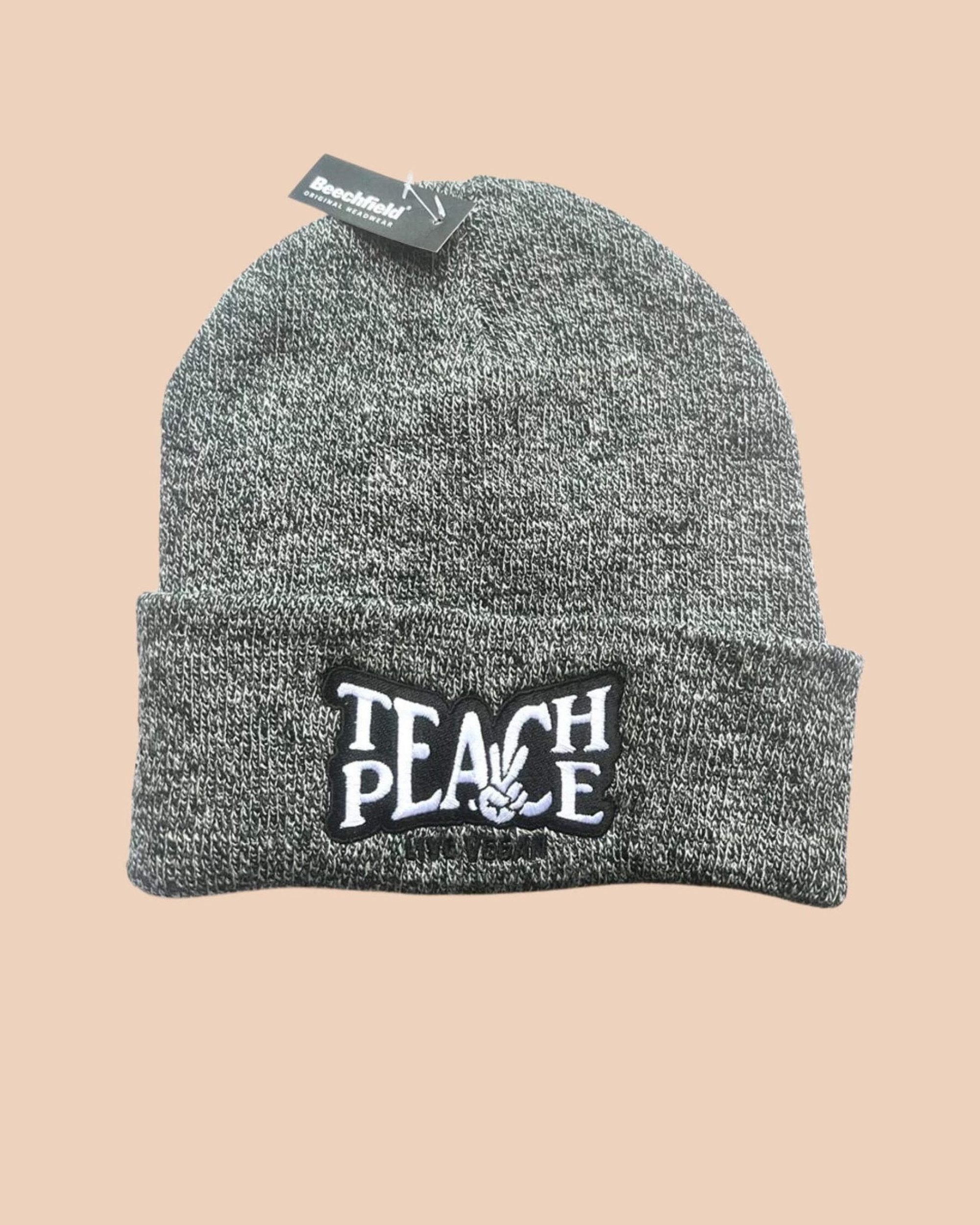 Flatlay photo of a cuffed beanie in grey heather colour with a black and white embroidery &