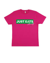 A flat lay photograpgh of a Pink Organic Cotton T-Shirt with a chest print with a graphic design stating "Just Eats plants".