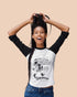 Femal model posing against a salmon coloured backdrop wearing one eco-ethical brand Viva La Vegan&