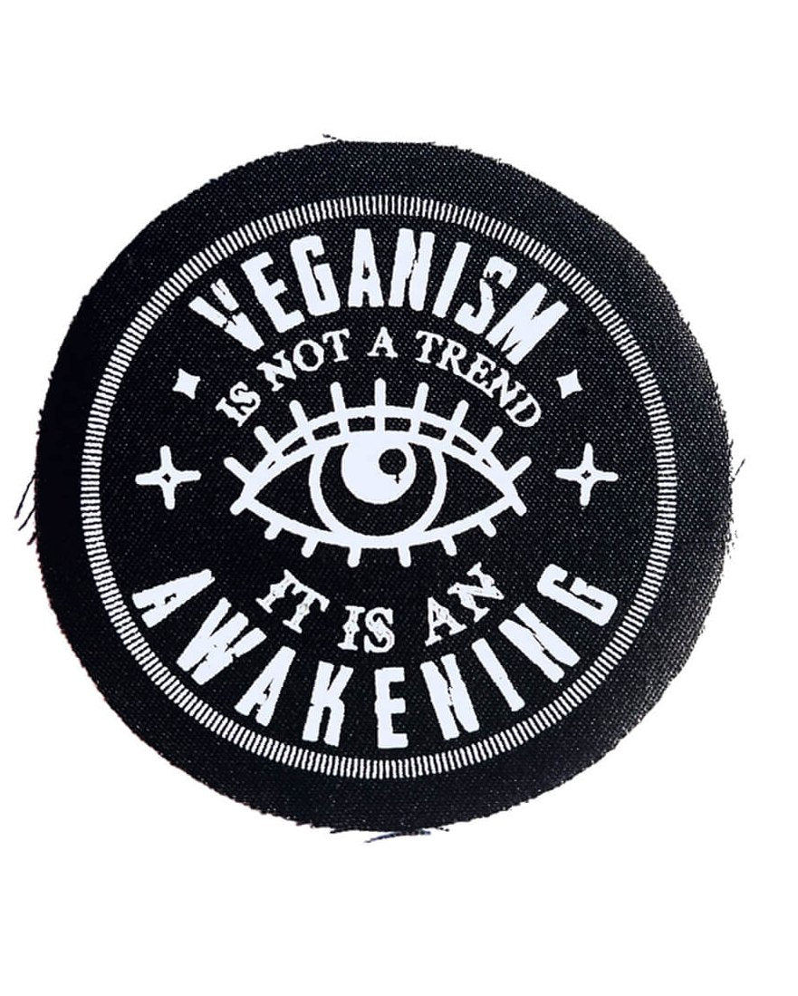 Round black patch with white print with the words - Veganism is not a trend it is an awakening. by Eco-ethical brand Viva La Vegan