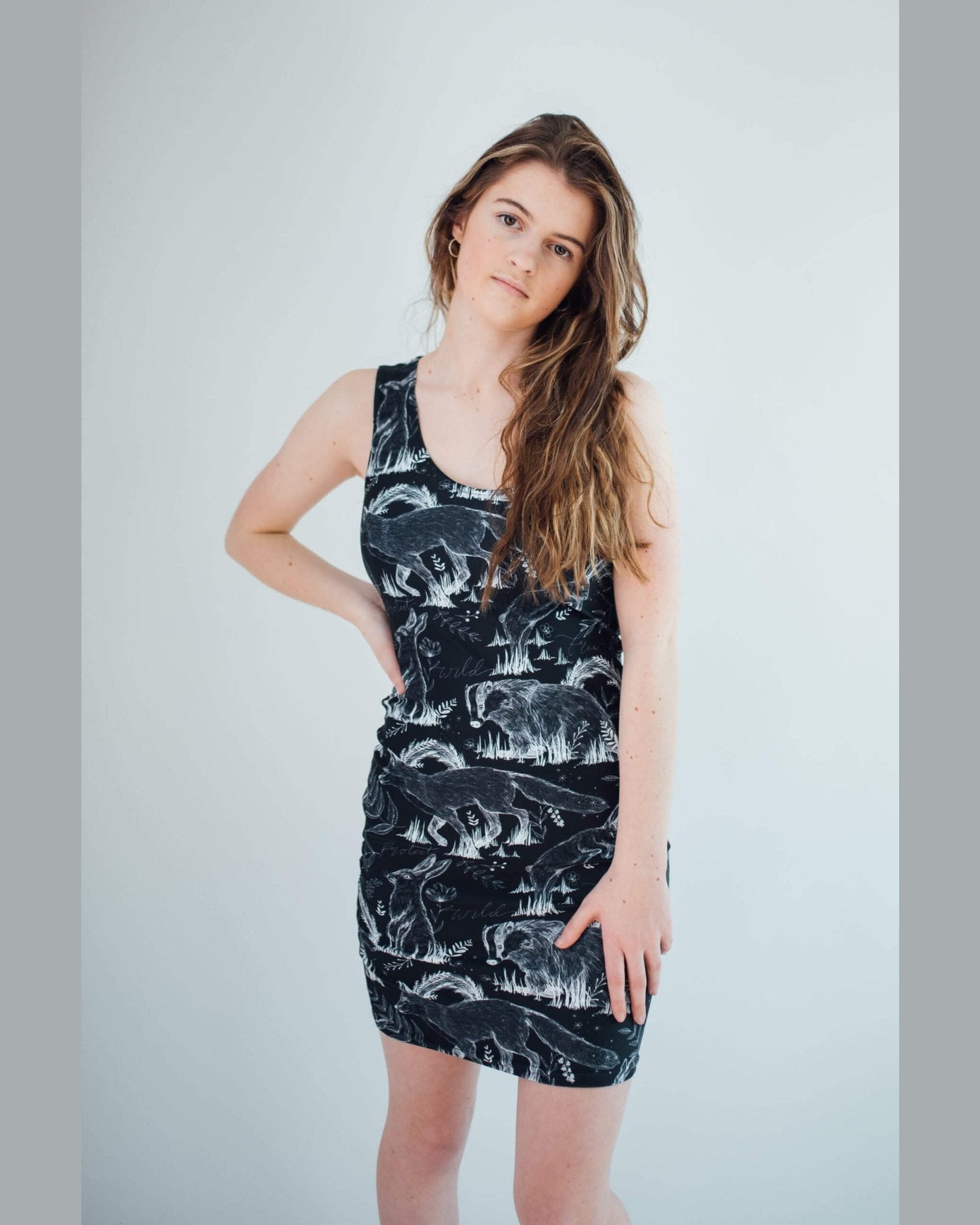 Vegan Model Angel wearing all over print wildlife dress