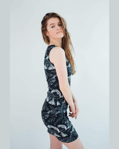 Vegan Model wearing wildlife dress side view