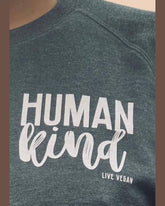 Human Kind unisex sweatshirt by Viva La Vegan. Close up of side chest print