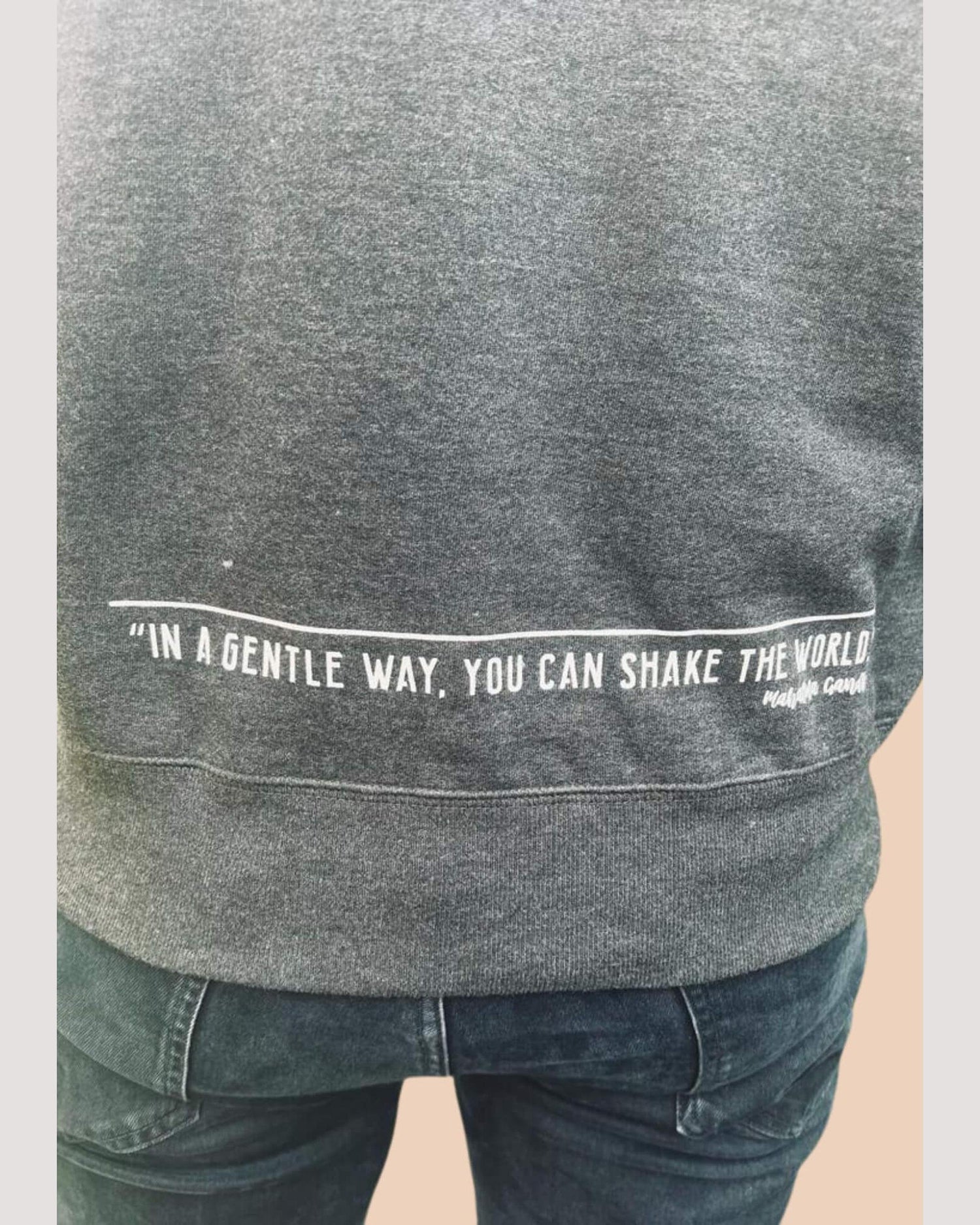 Human Kind sweatshirt back print detail with a quote &