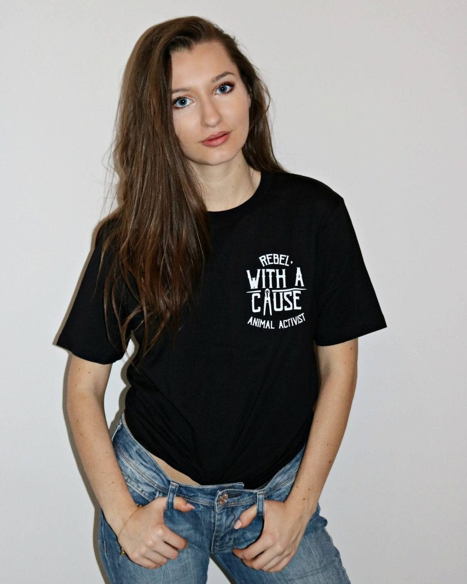 gender-women wearing a Unisex  black tshirt with  Rebel With A Cause slogan on the chest