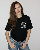 gender-women wearing a Unisex  black tshirt with  Rebel With A Cause slogan on the chest