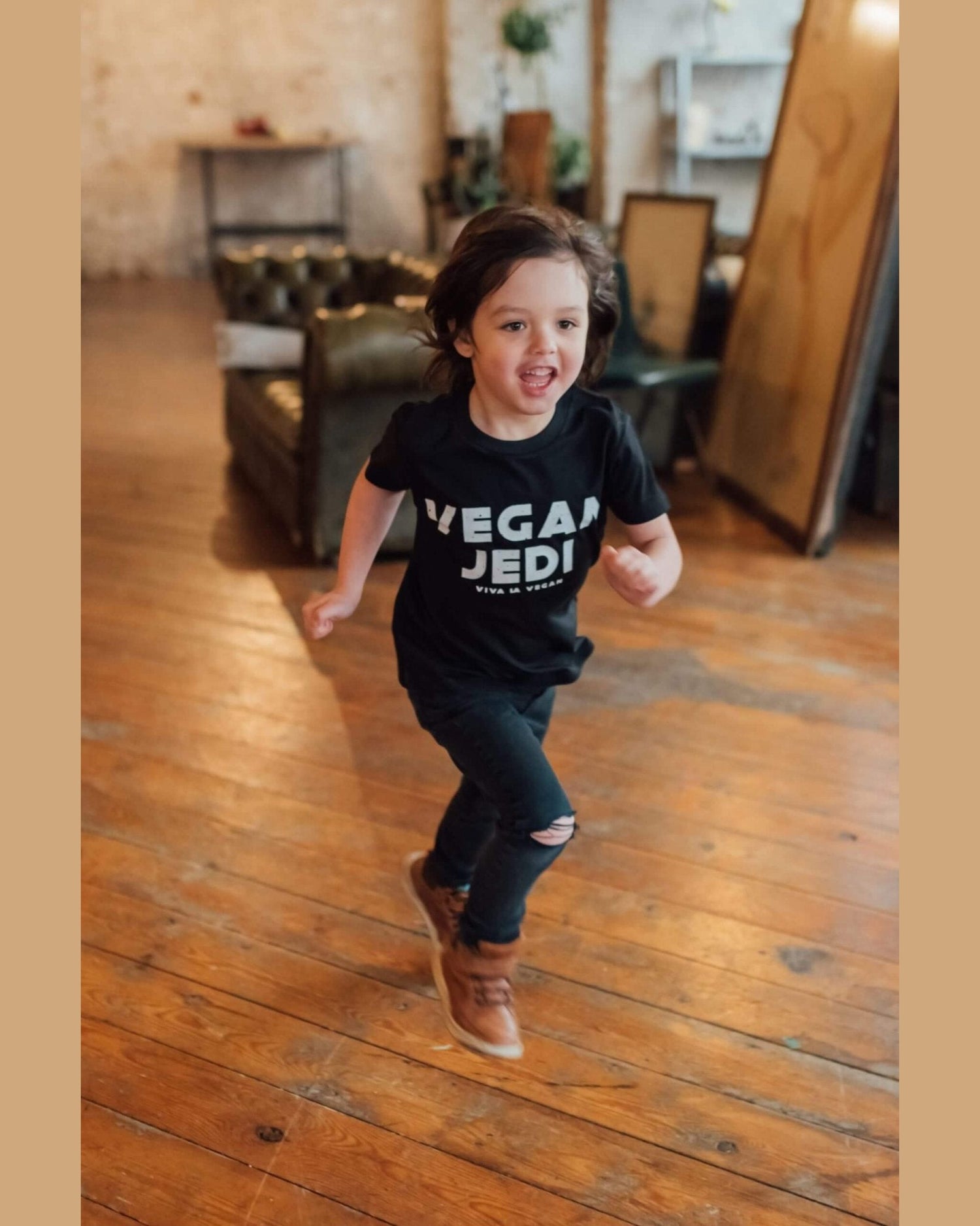 Model running wearing vegan jedi kids t-shirt