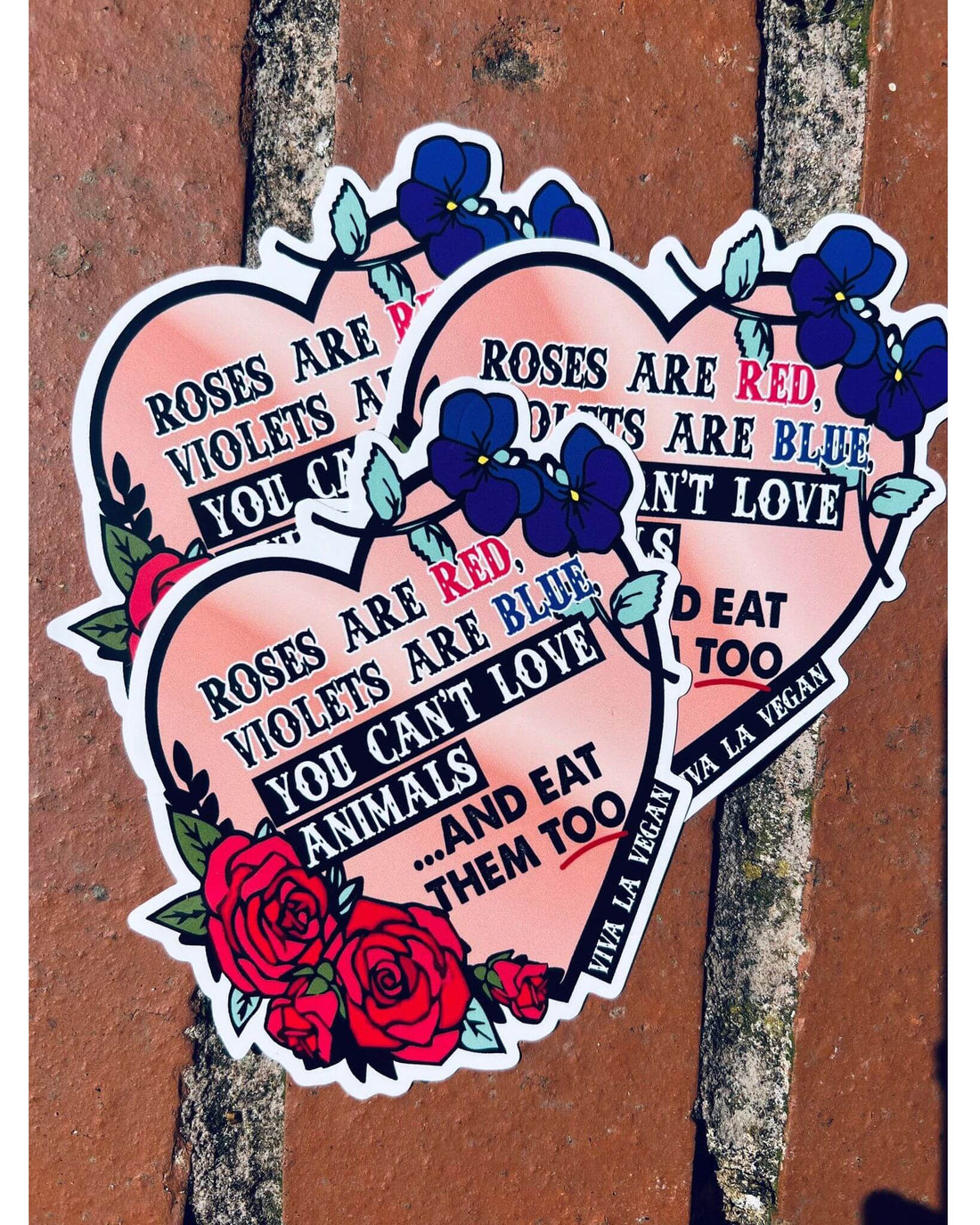 Roses are read violets are blue you cant eat animals and love them too stickers on a wall