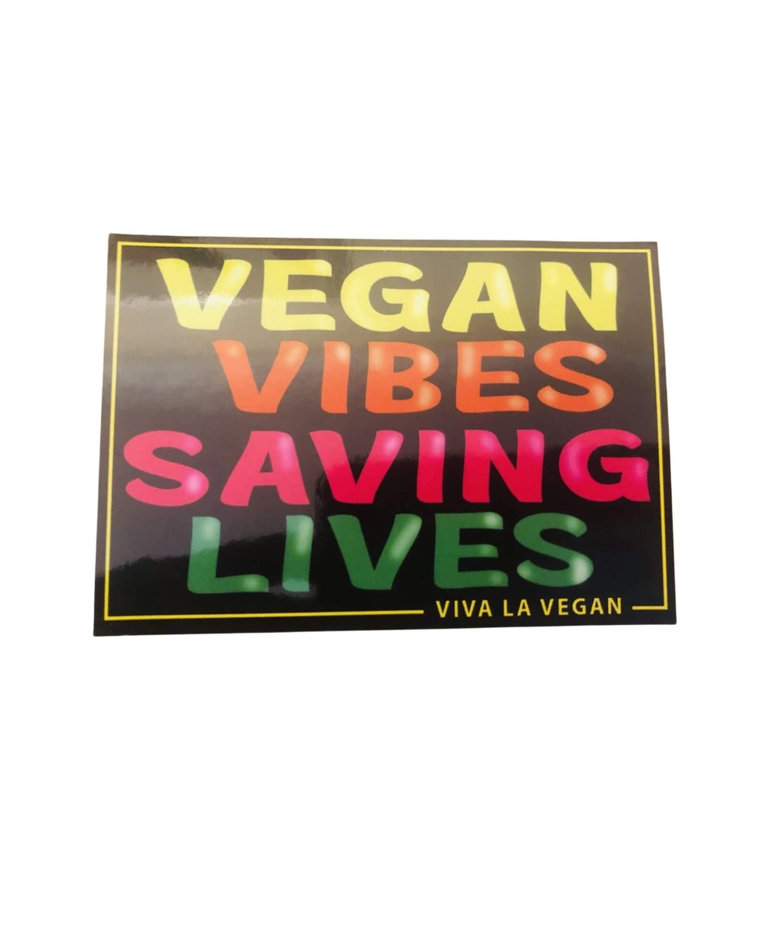 Photo of a vegan statement window cling that says "Vegan Vibes Saving Lives" as designed by Viva la Vegan
