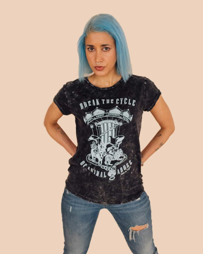 Woman modelling a pair of ripped jeans and acid black Break The Cycle organic cotton vegan tshirt. T-shirt created by award winning eco-ethical Viva La Vegan Clothing Brand.